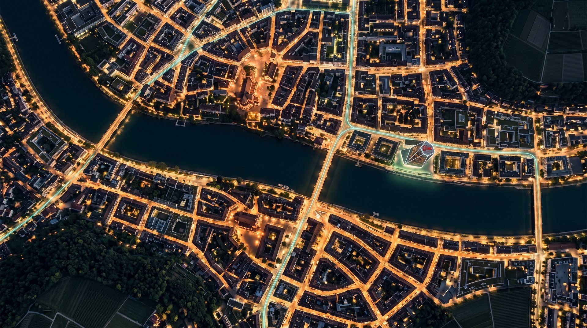 Basel 2050 bei Nacht, senkrecht von oben, mit dem Rheinknie